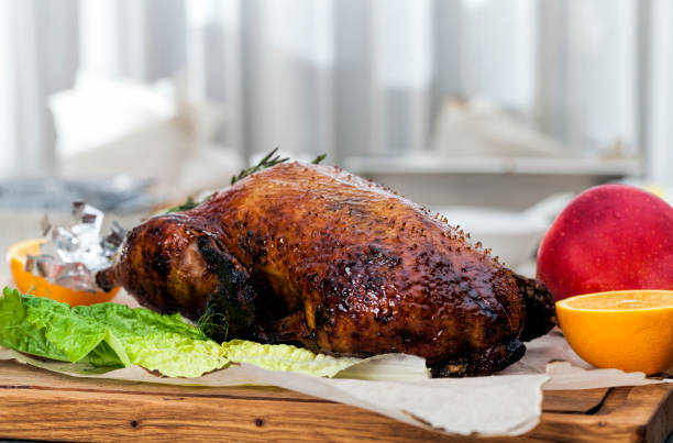 one baked duck for a holiday whole baked duck for a festive table, one baked duck for a holiday 2273 stock pictures, royalty-free photos & images