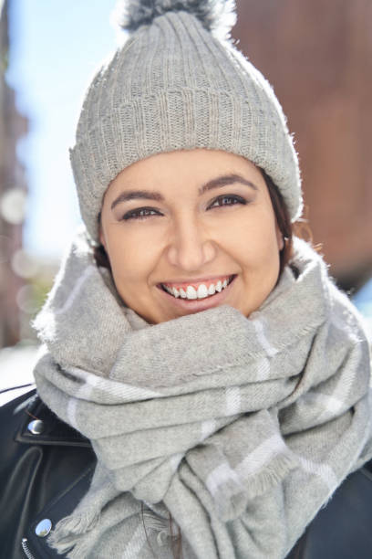 istock Merry young female in knitted hat 1360268324
