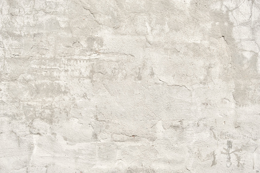Gray beige white cracked concrete wall texture background