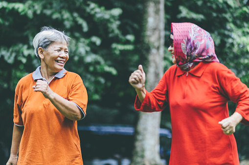 China, Beijing, June 5, 2011. A group mothers doing Tai Chi exercises for body health in the courtyard of Summer Palace complex.