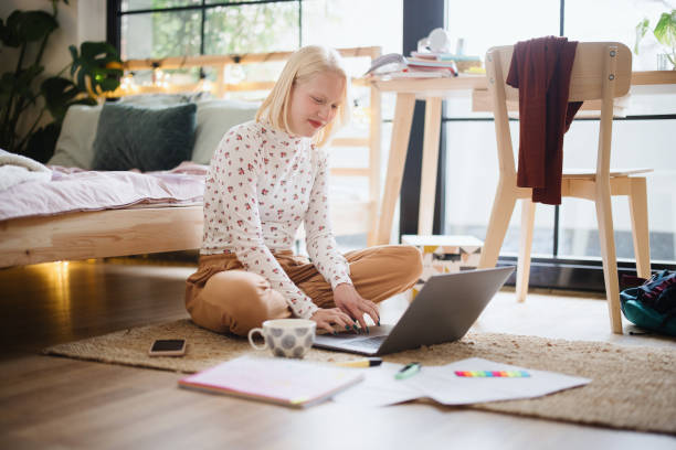 istock Young female student studying at home 1360271090