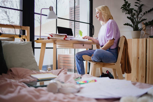 istock Young woman studying for her exams. 1360272032