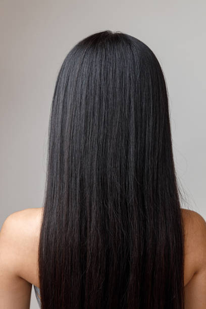 istock Brunette young woman with long hair standing in studio 1360273448