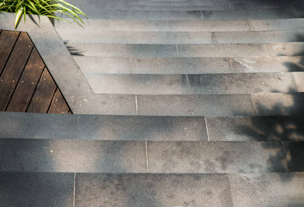 istock Concrete staircase and floor with sunlight and shadow in step path way park. 1360275152