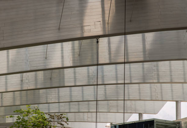 Burred light and shadow passing through architecture of Metal beams of the glass ceiling modern building. Burred light and shadow passing through architecture of Metal beams of the glass ceiling modern building. Selective focus. burred stock pictures, royalty-free photos & images