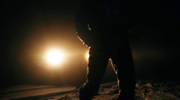 istock Man with car issues on winter road, phone calling for help. 1360275872