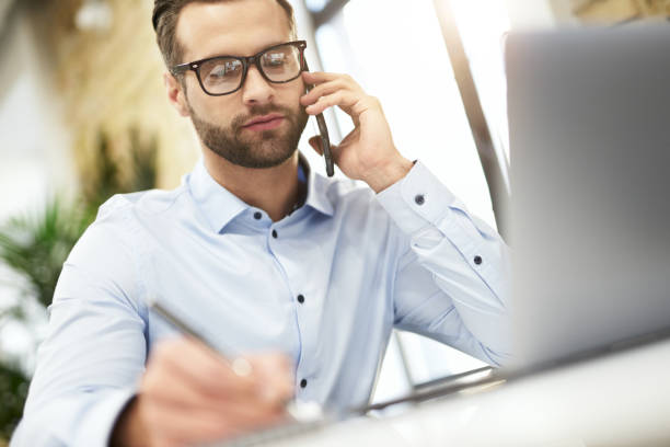 istock Writing down the information heard in phone talk 1360277665