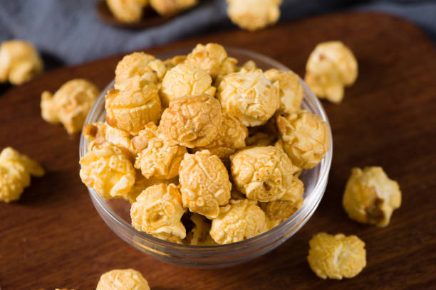 istock close up of popcorn in a bow  on wood background 1360286530