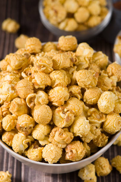 istock close up of popcorn in a bow  on wood background 1360286576