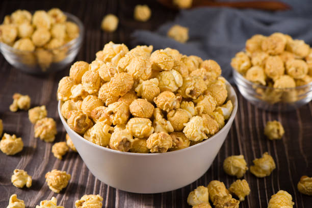 istock popcorn in a bow  on wood background 1360286593