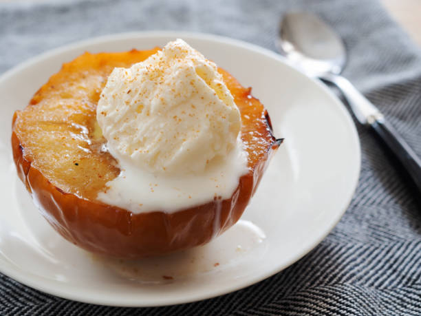 istock Baked apples with ice cream 1360287537