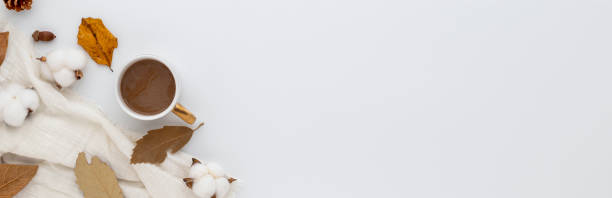 istock Autumn composition, coffee cup. dried leaves. and pine cones on white background. Flat lay, top view with copy space 1360288359