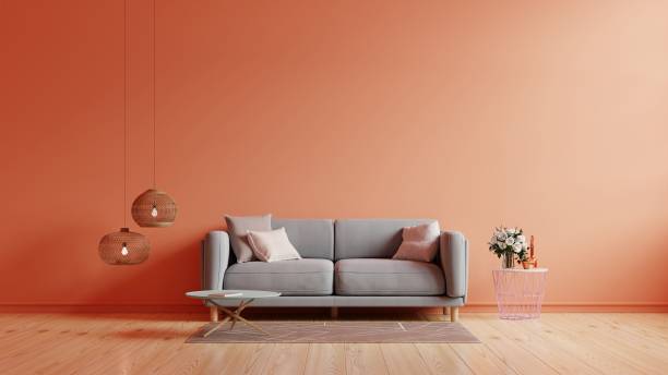 istock The interior has a sofa on empty calming coral wall background. 1360290888
