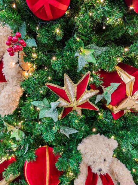 istock ornaments and lights on the Christmas tree 1360291024