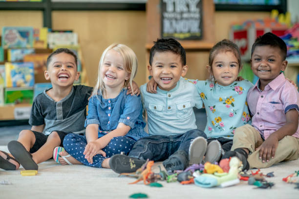 istock Group of Smiling Preschool Students 1360291964