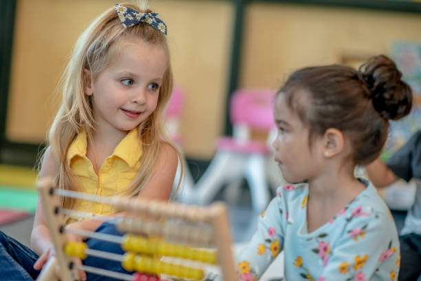 istock Cute Preschool Students Playing Together 1360291974
