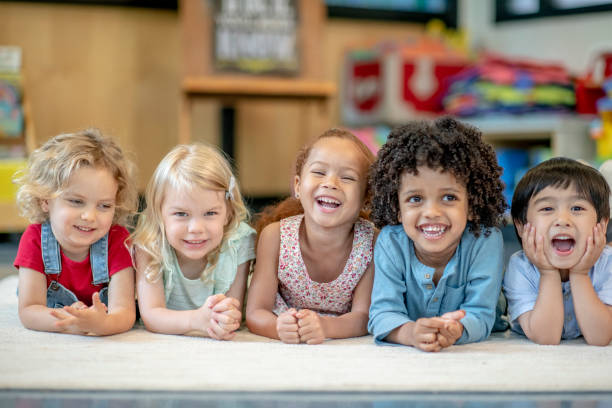 istock Group of Smiling Preschool Students 1360291977