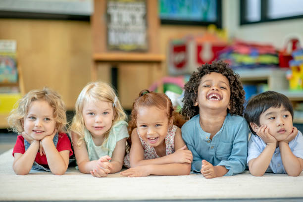 istock Group of Smiling Preschool Students 1360291979