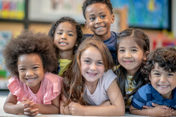 istock Group of Smiling Preschool Students 1360291986