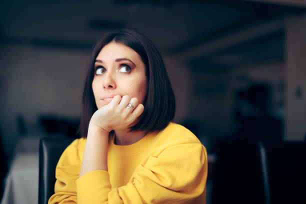 istock Bored Woman Waiting in a Restaurant Feeling Depressed 1360297535