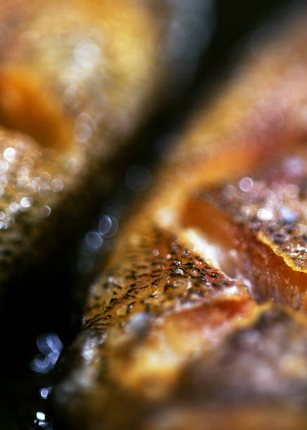 Frying fish with oil and bokeh