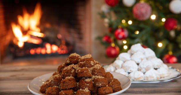 Christmas Greek dessert. Traditional homemade melomakarono and kourabies on a wooden table stock photo