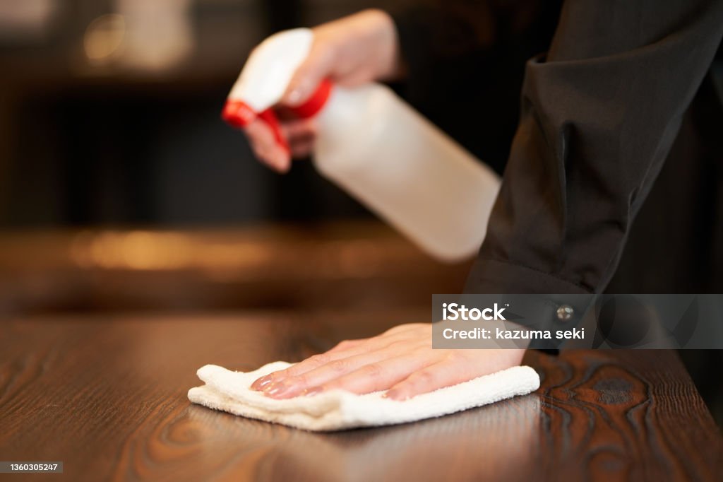 Hands of a female clerk who disinfects alcohol Cleaning Stock Photo