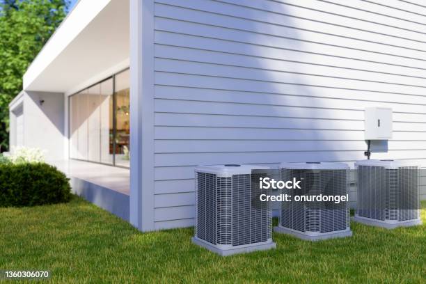 Exterior Of Villa With Air Heat Pumps In The Backyard Stock Photo - Download Image Now