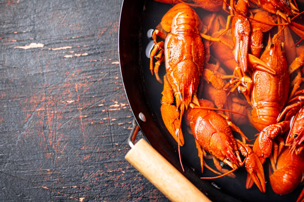 istock Crayfish are boiled in a saucepan. 1360312636