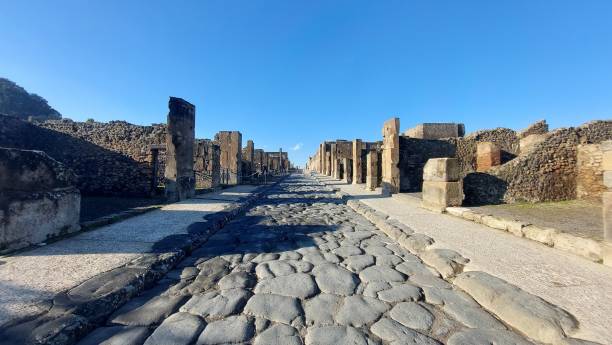istock Via dell’Abbondanza (Abundance street), the Lower Decumanus of Pompeii. 1360315517