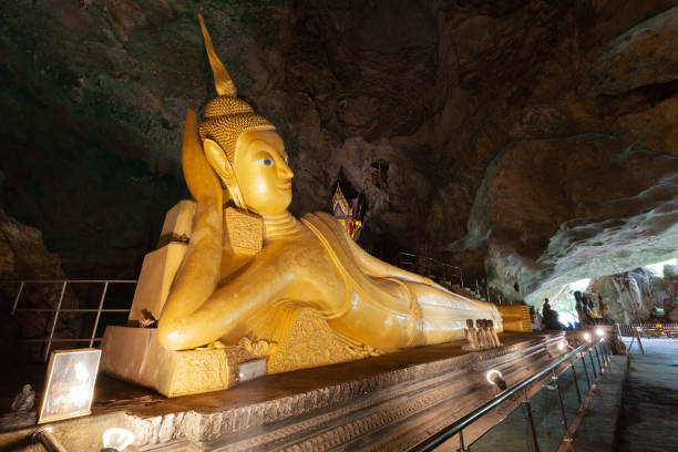 istock Golden statue of Reclining Buddha 1360315657