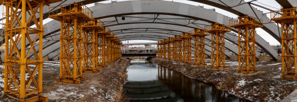 istock Supports of a reinforced concrete bridge. Building view 1360322146