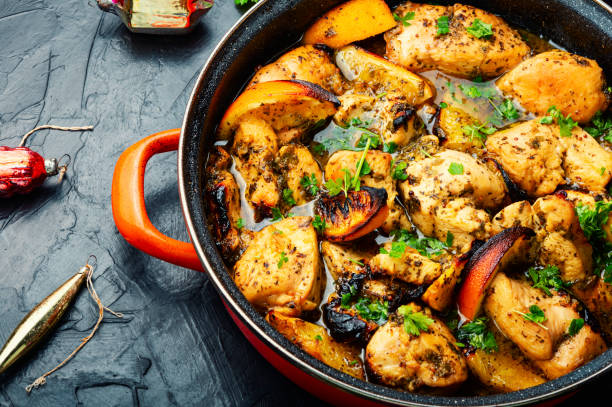 istock Pieces of chicken fillet in oranges. 1360322287