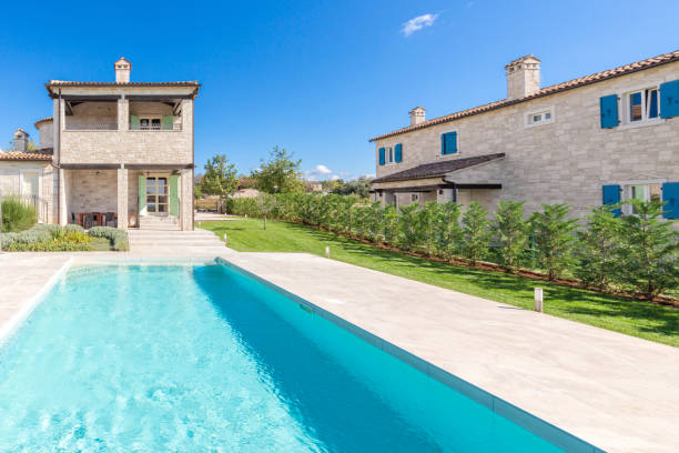 istock Luxurious beautiful modern villa with swimming pool and yard garden 1360323285