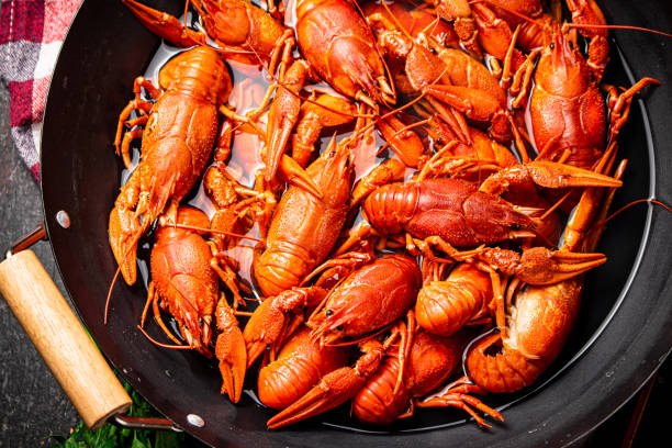 istock Crayfish are boiled in a saucepan. 1360323347
