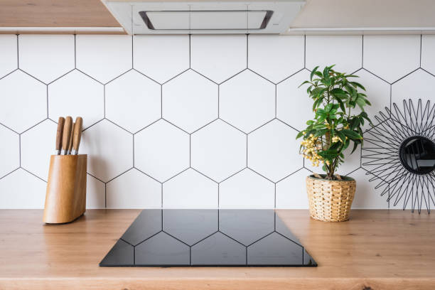 istock Induction cooker in new modern kitchen interior design 1360324700