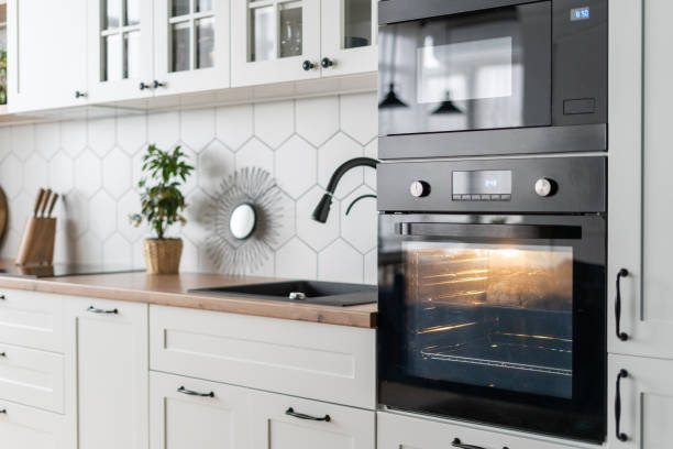 istock Black oven in modern kitchen interior design 1360324750