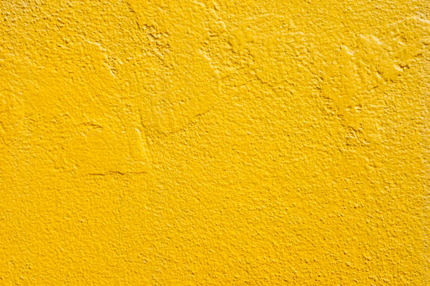 istock surface of blank rough yellow concrete wall for background. 1360327987