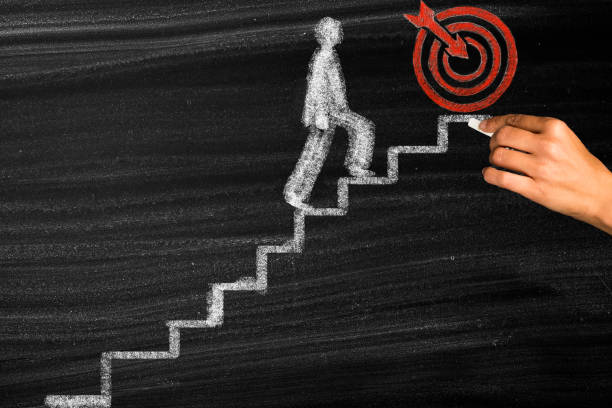 Man walking on drawing stairs to target