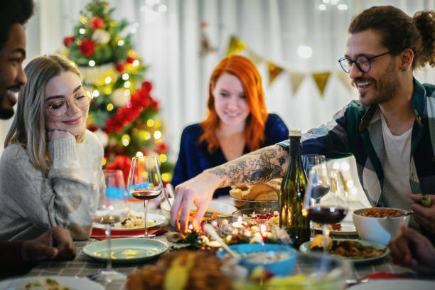 istock Friends enjoying the Christmas dinner together. 1360332956