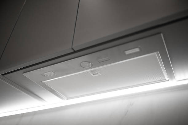 istock Led backlight in small kitchen exhaust hood with modern furniture 1360333964