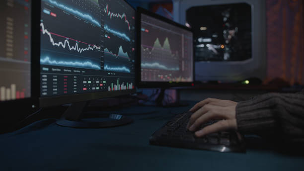 istock Young person who analyzes cryptocurrencies at the computer and trades or margin trades 1360335786