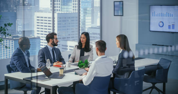 istock Modern Multi-Ethnic Office Conference Room Meeting: Diverse Team of Young Top Managers, Executives Talk, Brainstorm, Use Tablet. Smiling Businesspeople Discuss Investment Strategy in ecommerce Startup 1360337401