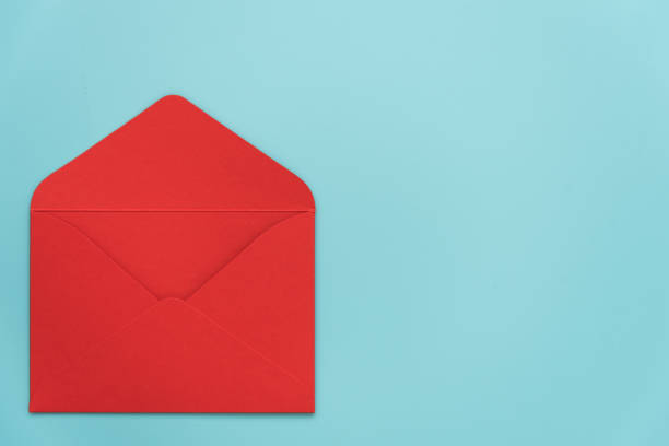 istock An open red envelope on a blue background. There's room for text. Stylish Valentine's Day card. Declaration of love. Invitation to a wedding, birthday or Christina. Passionate love 1360338803