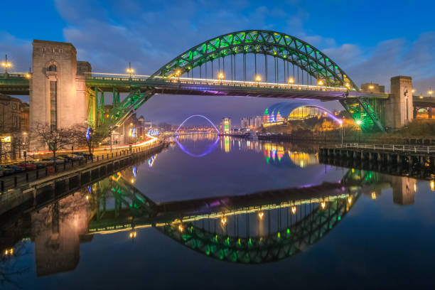 Festive lights on Tyne Bridge at Christmas Long exposure of festive lights on Tyne Bridge and Newcastle`s quayside at Christmas tyne bridge stock pictures, royalty-free photos & images