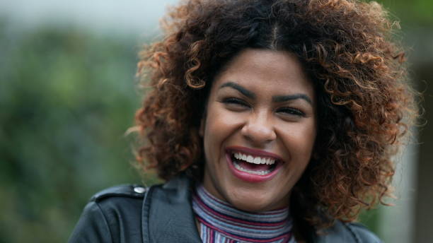 istock Ecstatic woman feeling happy looking at sky. Joyful person with HOPE 1360340333