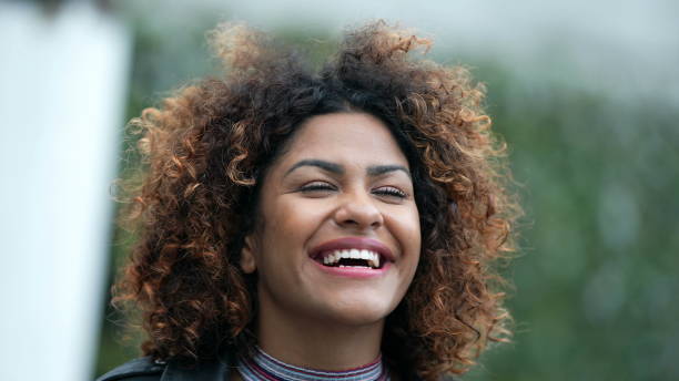 istock Ecstatic woman feeling happy looking at sky. Joyful person with HOPE 1360340447
