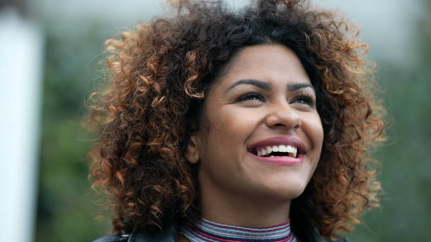 istock Ecstatic woman feeling happy looking at sky. Joyful person with HOPE 1360340512