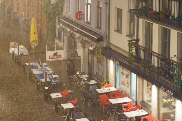 Brussel, Belgium - June 5, 2019: View from the window on the street in summer night. Place du Jeu de Balle, Vossenplein - square located in the heart of the Marolles, Marollendistrict of Brussels.