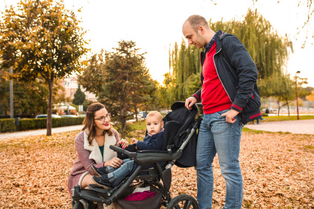 istock Young parents with their little son in the park 1360341872